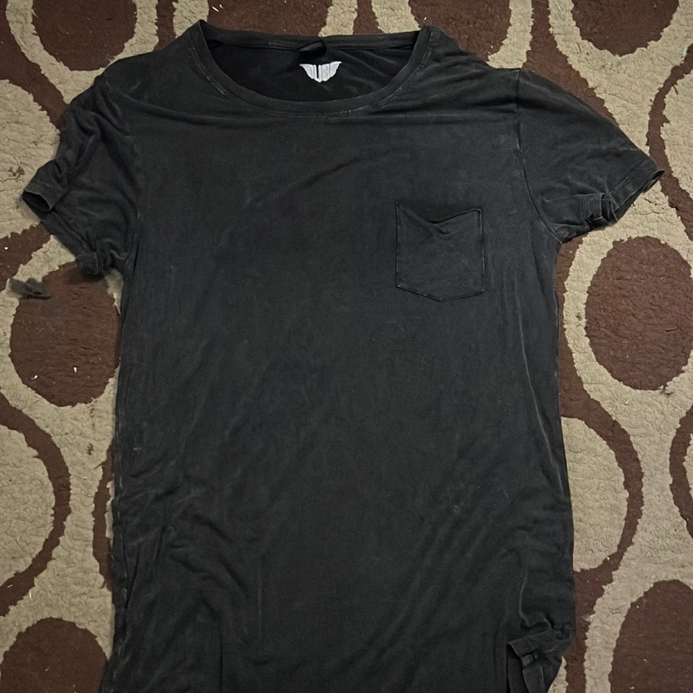 Oversized soft cloth work out shirt. Big collar and opens at bottom